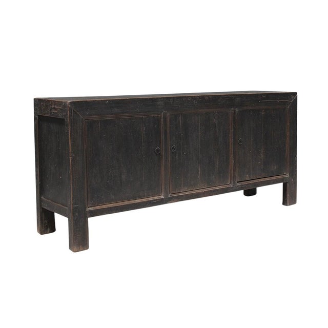 This vintage sideboard is made from reclaimed solid wood featuring a weathered, dark charcoal brown finish with rustic...