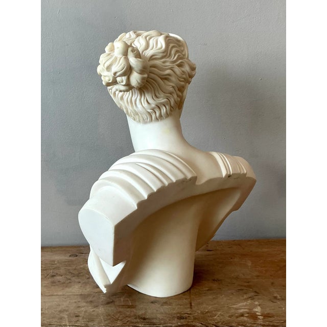 Presenting a commanding vintage cast stone bust, elegantly depicting Artemis, the Greek goddess of the hunt, wilderness,...