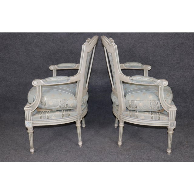 Dimensions: 34.25 inches high x 23 inches wide x 23 inches deep. Seat height 19 inches. An elegant and highly refined pair...