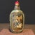 This is a charming vintage Chinese snuff bottle, crafted from Liuli (traditional Chinese glass) with an inner-painted...