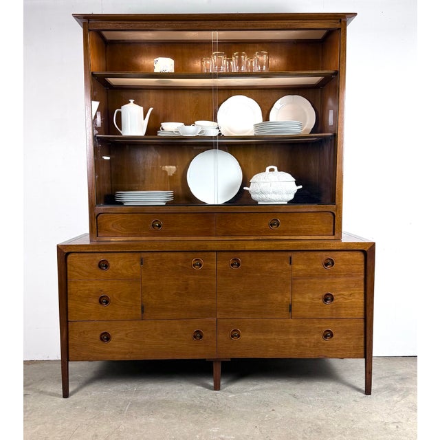 A fabulous Counterpoint credenza / hutch in walnut designed by John Van Koert circa 1960’s. Features 8 drawers and 2...