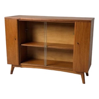 Mid-Century Drinks Cabinet in Teak with Glass Sliding Doors and Adjustable Shelf For Sale