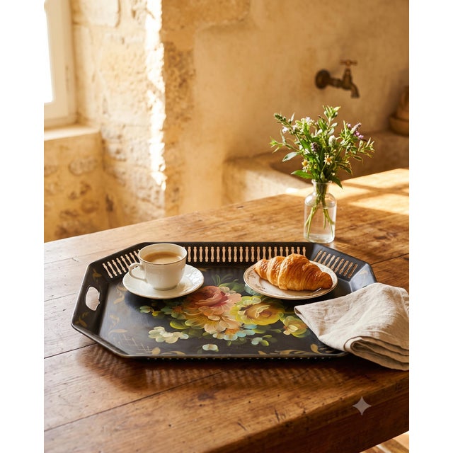 ✦ A vintage hand-painted toleware serving tray with a soft, muted floral bouquet on black and a pierced gallery rim — a...