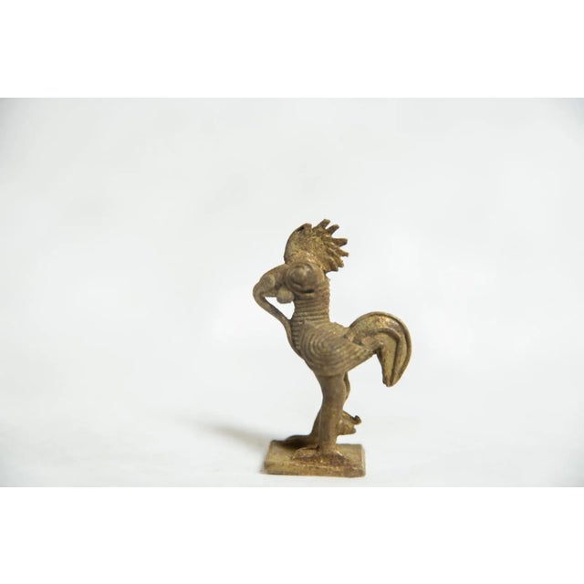 :: Vintage handmade bronze sculpture of a rooster with dark iron-like patina, and what appears to be some kind of armor,...