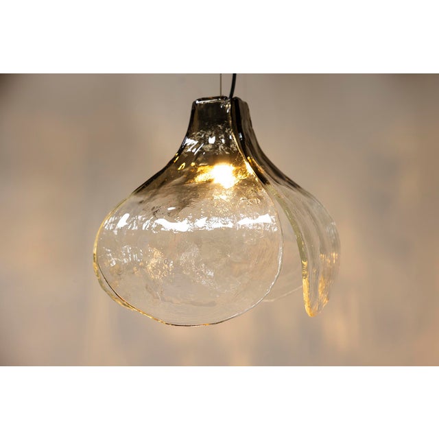 This pendant lamp embodies a harmonious blend of artistry and functionality. Designed in the shape of a flower, it brings...