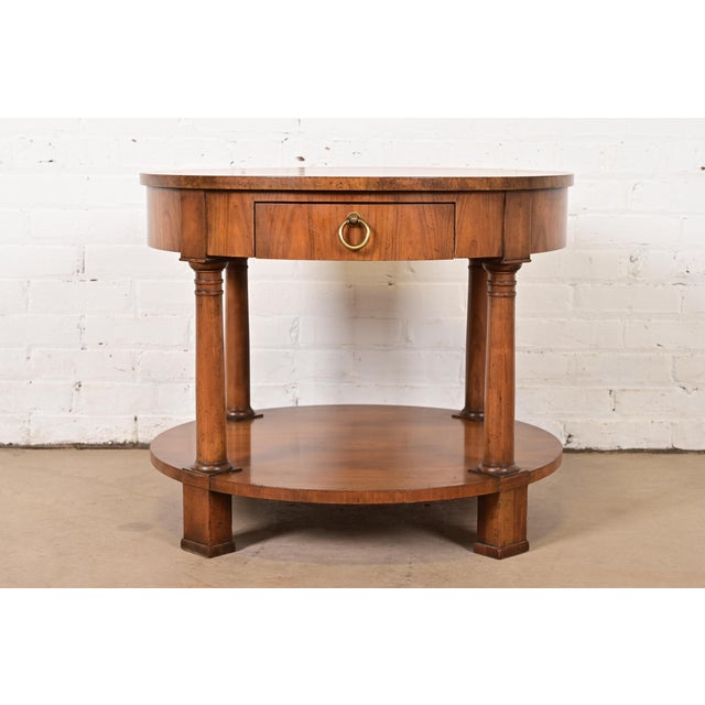 A gorgeous French Empire style tea table, occasional side table, or nightstand By Baker Furniture USA, Circa 1960s Cherry...