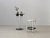 A rare postmodern set by kartell, consisting of the model 4581 standing table and two matching polo bar stools, designed...