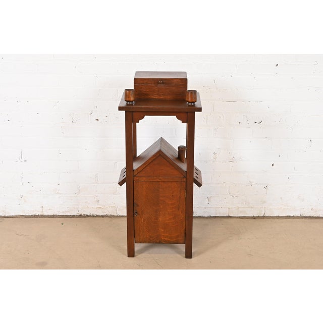 A very unique and exceptional antique Mission or Arts & Crafts period smoker's stand In the manner of Stickley Brothers By...