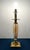 A striking Hollywood Regency statement piece attributed to Speer Fine Lighting. This lamp features a tall amber-toned...