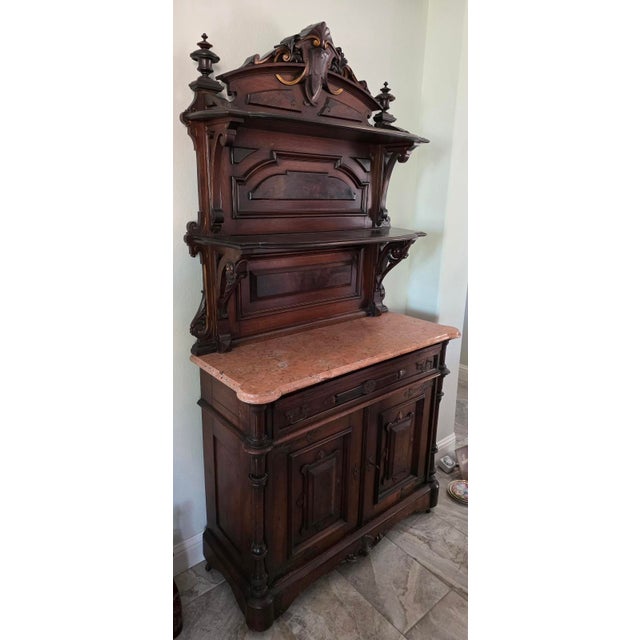 An exceptional 19th-century French Renaissance Revival (Henri II style) walnut buffet deux corps / sideboard server,...