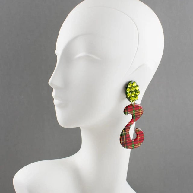 These impressive Italian Lucite or Resin dangling clip-on earrings feature an oversized chandelier shape with an "S"...