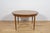 This round extendable dining table was produced by G-Plan in the 1960s. The table has profiled reinforced edges of the...