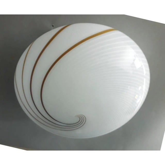 Vintage Italian flush mount or wall light with a single Murano glass shade with ribbed spiral pattern in frosted white and...
