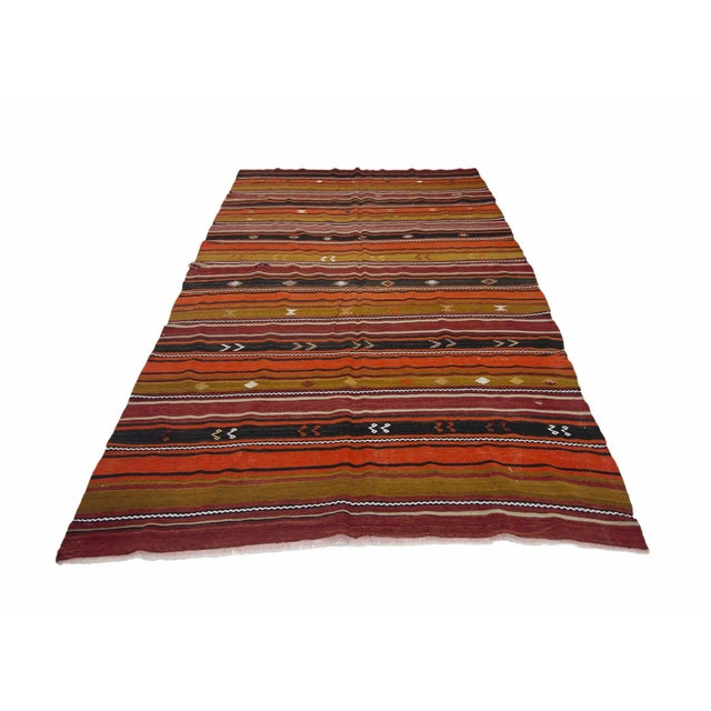 Handwoven vintage kilim rug from Denizli region of Turkey.Approximately 45-55 years old. In good condition.