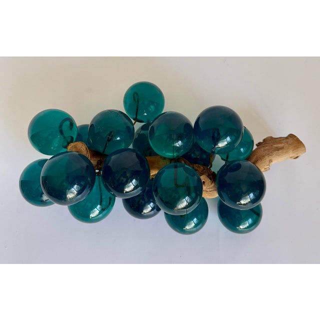 Here is a wonderful vintage lucite grape cluster sculpture, likely dating to the 1960s, featuring a striking arrangement...