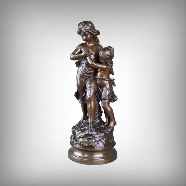 For this large bronze with a brown patina entitled "Surprise," Hippolyte Moreau captures a moment of emotion, where two...