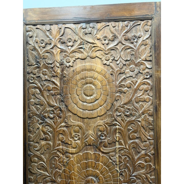 A breathtaking pair of hand-carved solid wood doors featuring a sacred triple lotus motif, symbolizing purity, balance,...