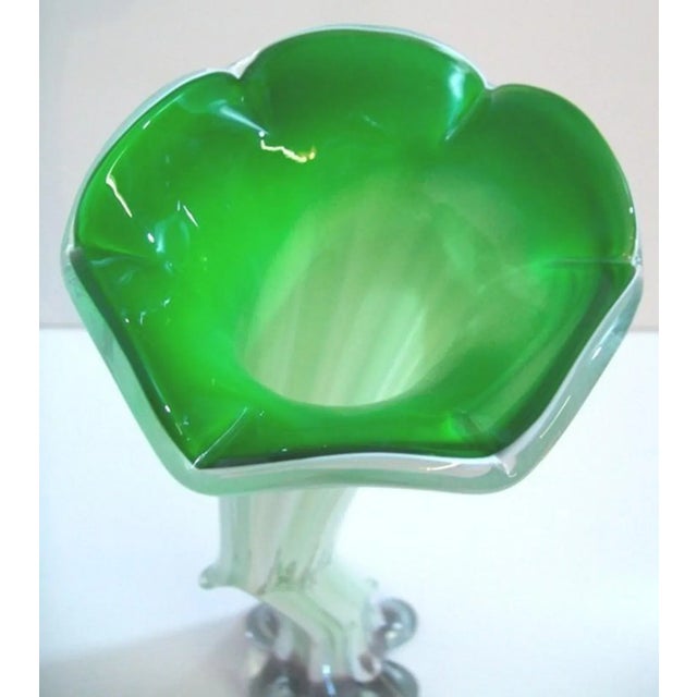 A Murano free form cased art glass vase with a flared mouth and asymmetrical form. This 1970's era Italian art glass is...