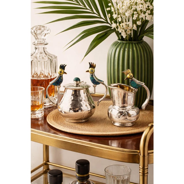 Striking mid-century modern creamer and covered sugar set designed and manufactured in Taxco, Mexico by the renowned...