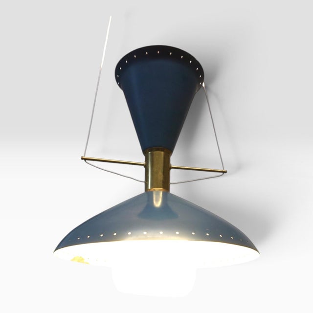 This striking mid-century pendant lamp is attributed to the swiss manufacturer bag turgi, based on the close stylistic...