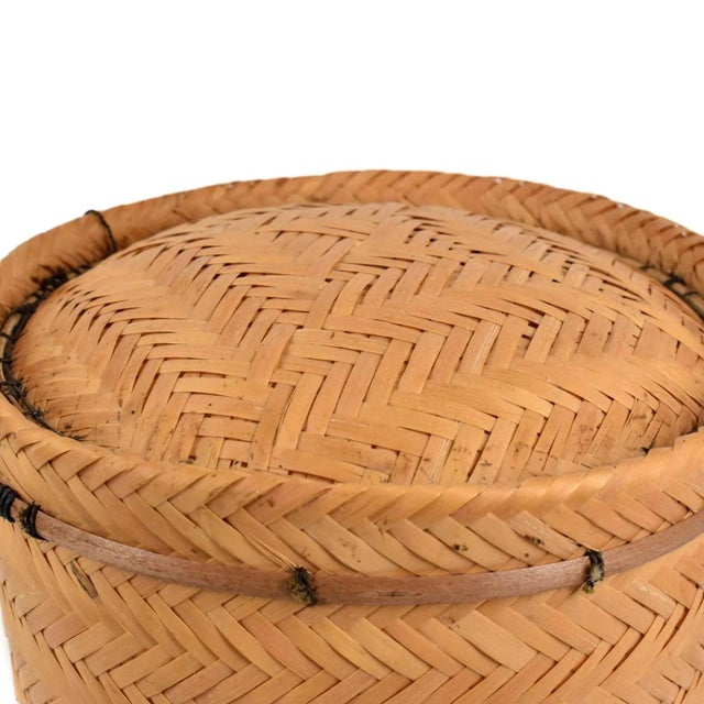 The Ye'kuana basket, a traditional craft of the Ye'kuana people in the Amazon, is meticulously woven from Moriche palm...