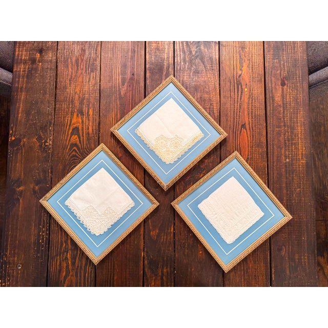 A beautiful set of three vintage lace handkerchiefs professionally framed as decorative wall art. Each delicate textile...
