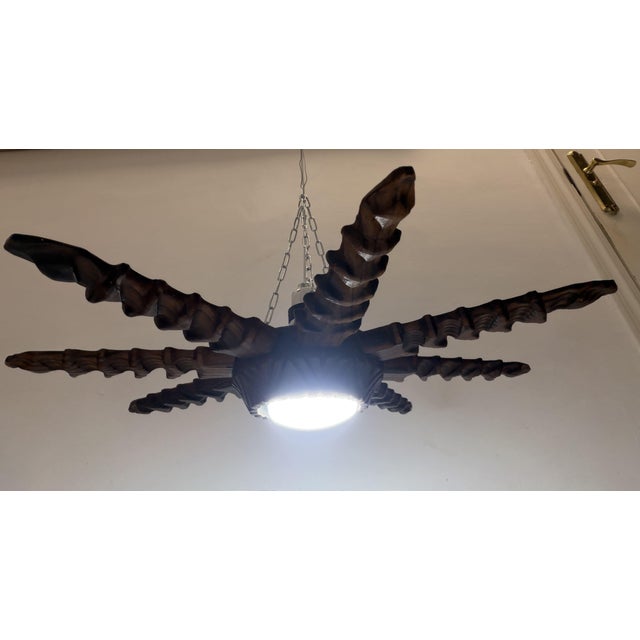 Sunburst Ceiling Lamp Vintage Spain, 1940s Hand-carved wood, 52 cm in diameter Height without chain: 15 cm Height with...