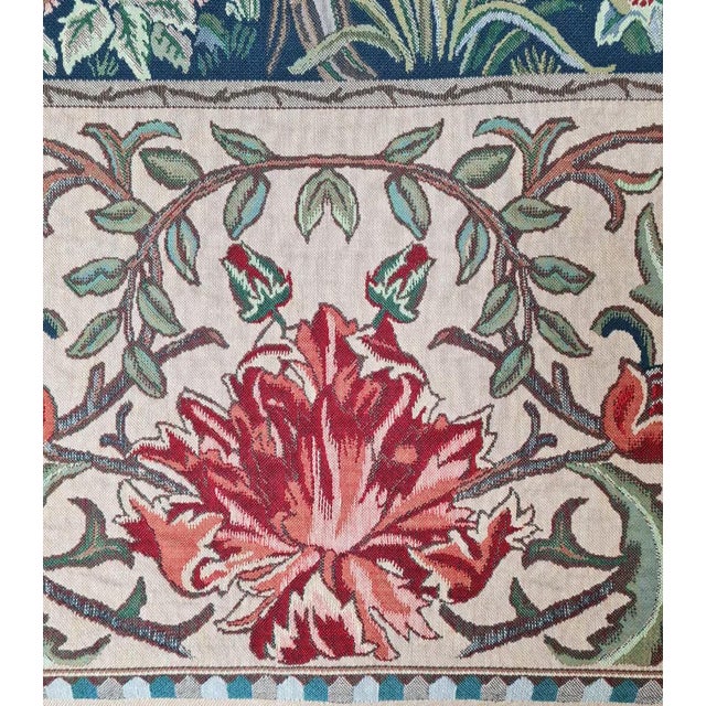 This tapestry is also known as The Tree of Life and is from an embroidered wool portiere designed by John Henry Dearle...
