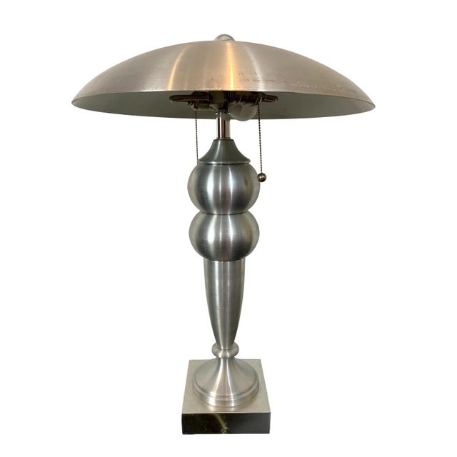 Mid-Century Modern brushed aluminum table lamp and shade with lucite finial, French, circa 1970. Measure: 27-inches high.