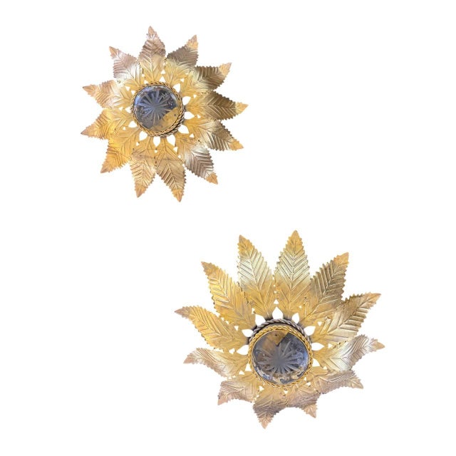 Circa 1940’s French gilt metal sunburst flush mounted light fixture with 2 interior lights. Available 2 items