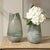 This Striking Pair Of Glass Vases Feature An Elegant Silhouette With An Artfully Crinkled Rim. The Seeded Glass Has A...