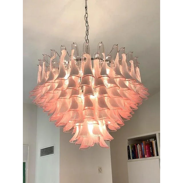Contemporary and vintage Mazzega style chandelier. White and trasparent “Selle” elements in Murano glass poured over a...