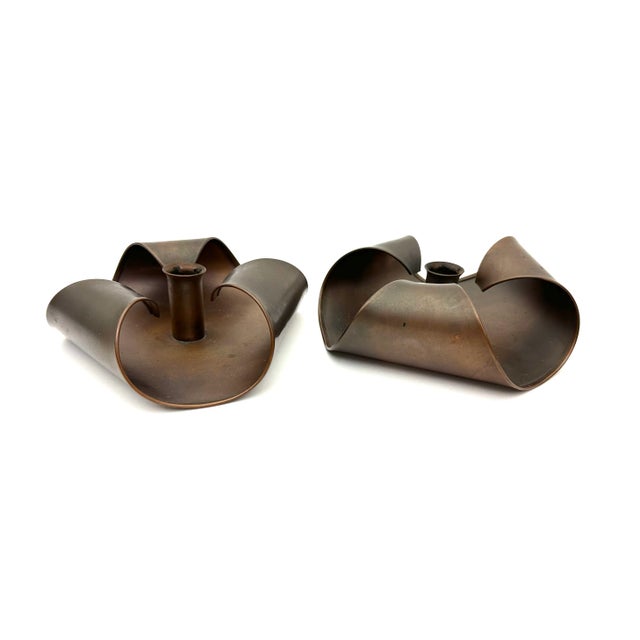 This pair of handmade copper candlestick holders were part of the mid-century Arts and Crafts Revival Movement. The design...
