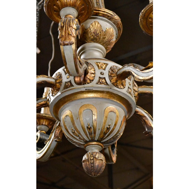 Alluring 19th century continental carved and parcel-gilt 8-light chandelier. circa 1870