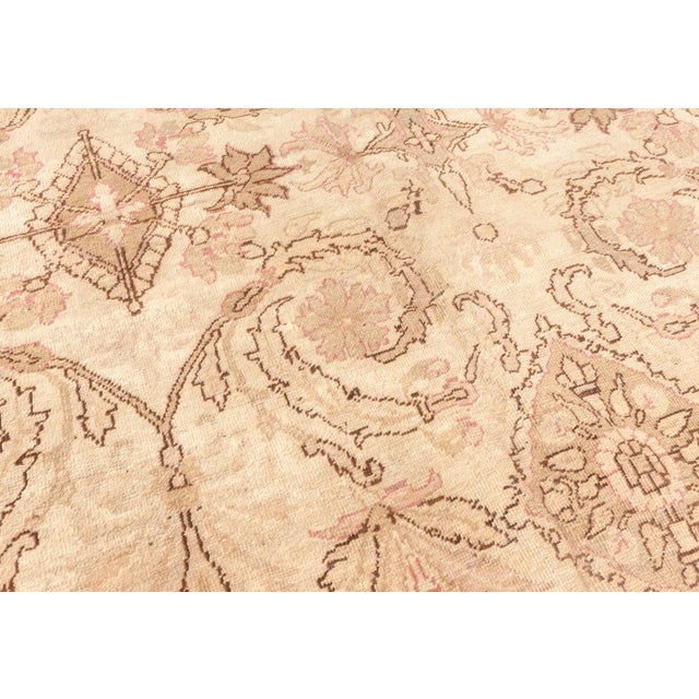 A highly decorative early 20th century Indian Amritsar antique carpet, the sand field with a sophisticated trellis of...