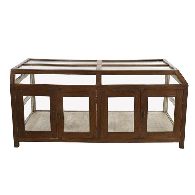 Wooden presentation showcase (old teak) from the 1940s. This piece is designed in the style of the selected designer...
