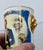 Commemorative beaker created by Caverswall celebrating the 2005 wedding of Prince Charles and Camilla Parker Bowles. Gold-...