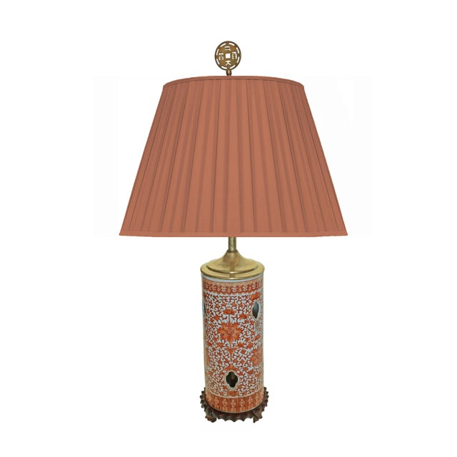 Chinese porcelain hat stand with pierced quatrefoil ventilation. The vibrant iron-red enamels are set against a white...