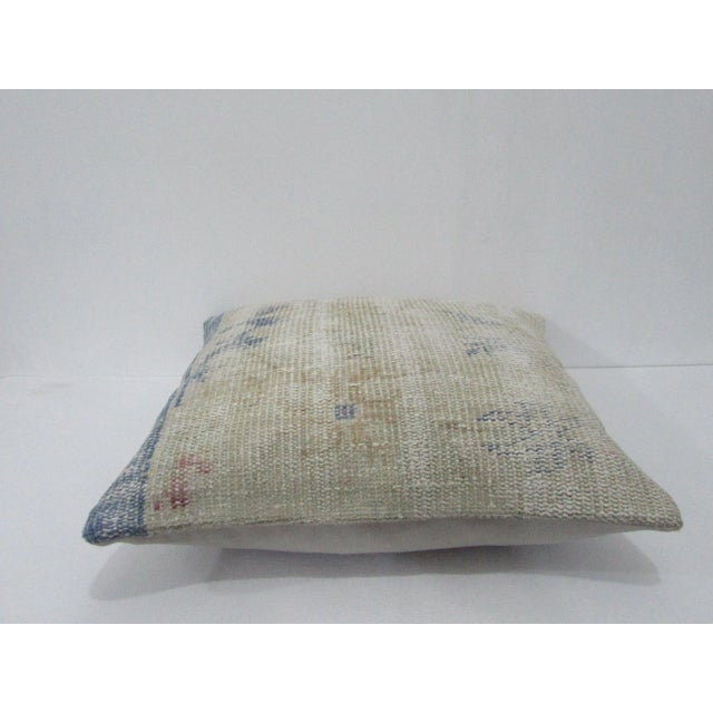 Decorative pillow cover made from a vintage Turkish handknotted rug. Backed with good quality cotton fabric. Pillow...