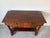 Elegant antique Empire-style console table featuring richly figured, two spacious drawers with brass bail pulls, classical...