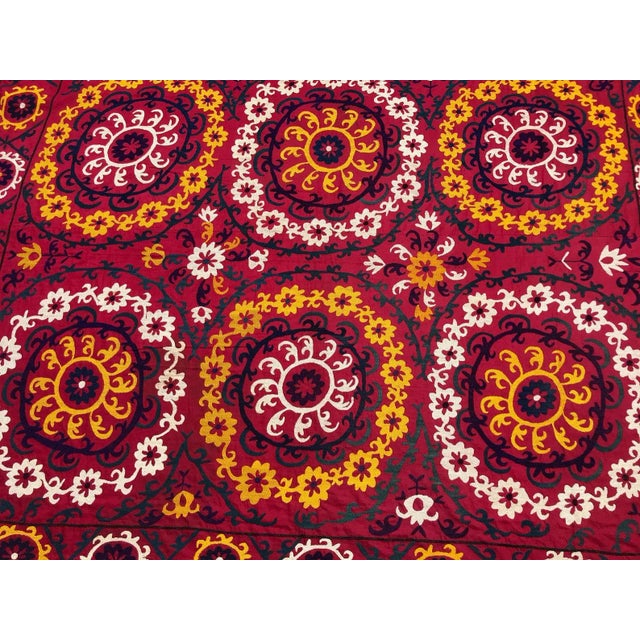 Vintage handmade suzani fabric. Looks beautiful in any home setting and is a great accent to any room. Can be used as wall...