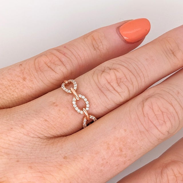 This beautiful band features 60 natural earth mined diamonds set in solid 14K Rose gold. This diamond band makes a lovely...