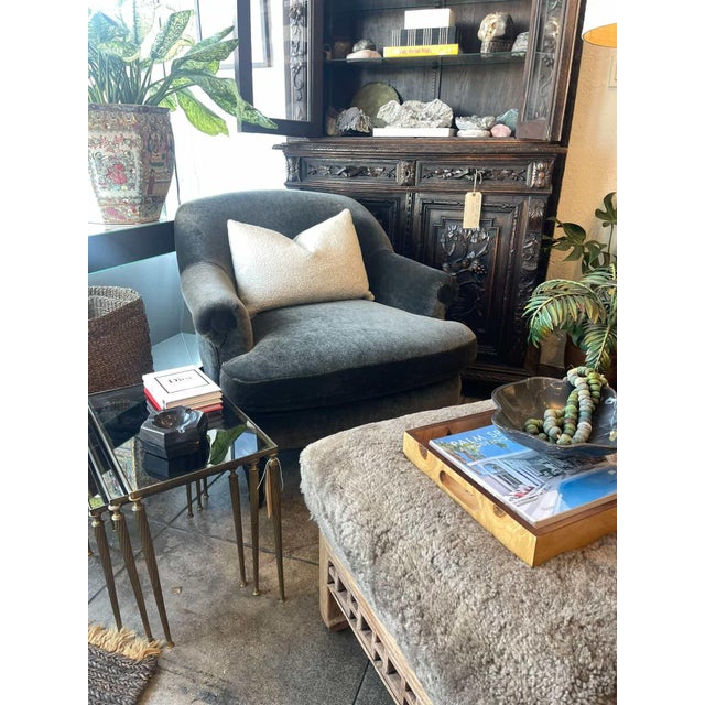 A softly curved accent chair upholstered in a smokey blue-gray mohair with a subtle sheen. Featuring a generous seat,...