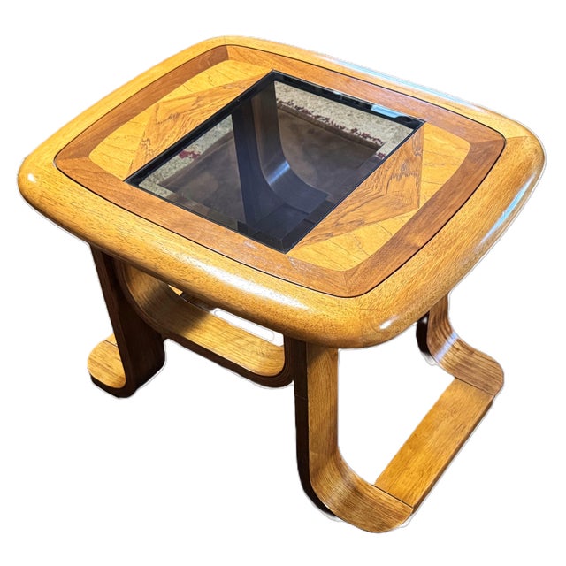 This is a mid-century modern side table, often attributed to the "Golden Age" of bentwood furniture design. Crafted from...
