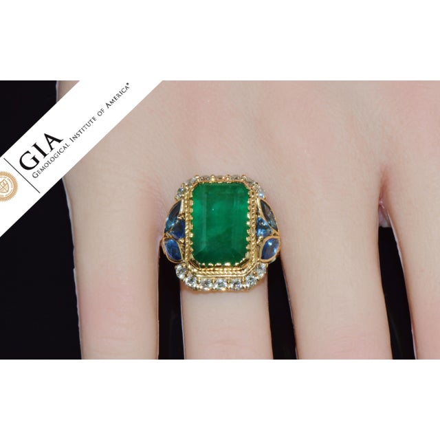GIA certified 12.80CTS diamond, sapphire, and emerald solid 18K gold ring. This ring features a massive GIA certified...