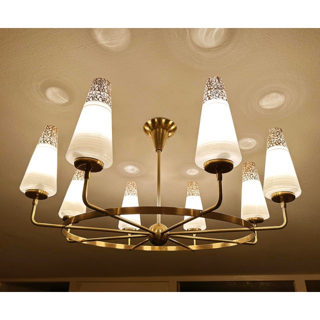 Large vintage Italian chandelier, very rare design featuring a wheel shaped design with a central orb and eight radiating...