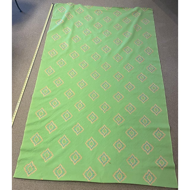 Designer's Guiild Minakari Lime fabric is 50" wide cotton sailcloth in a lime green with gold and blue embroidered...