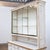 Antique wooden pastry display case, consisting of a glazed upper section and a lower section with drawers. The upper...