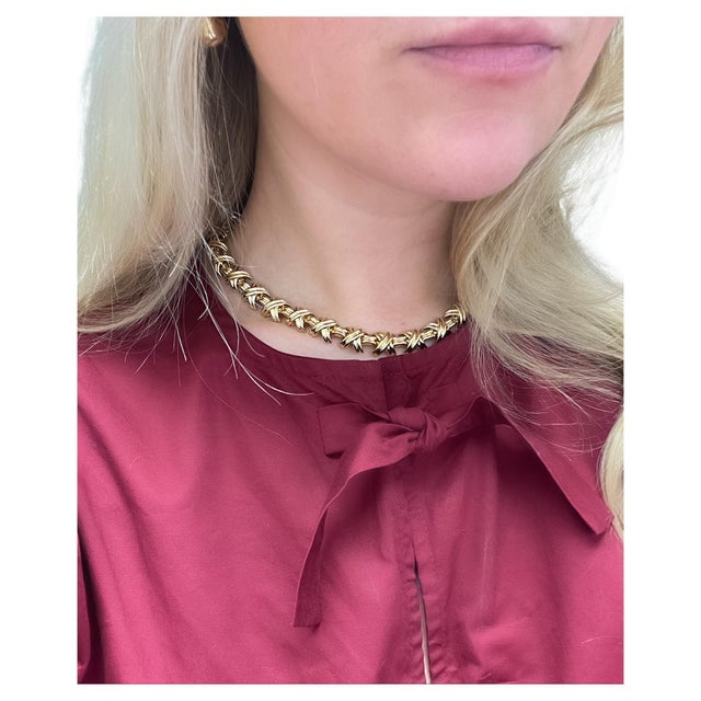 This classic necklace by Tiffany & Co. is a part of their Signature X Collection. Crafted in high polished 'x' links this...