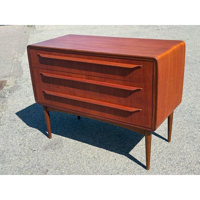 Rare Danish teak dresser by Johannes Andersen, dating from the 1960s. Featuring three drawers with beautifully sculpted...